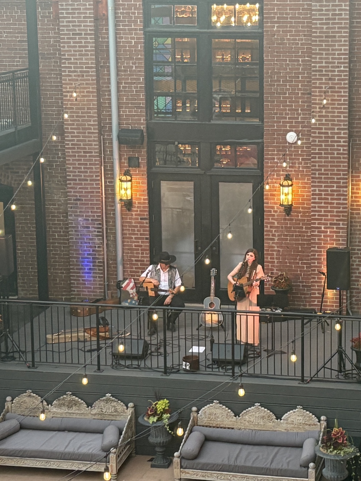 Nettie and the Delta Boy performing in a brick courtyard